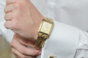 Person wearing gold and silver watch