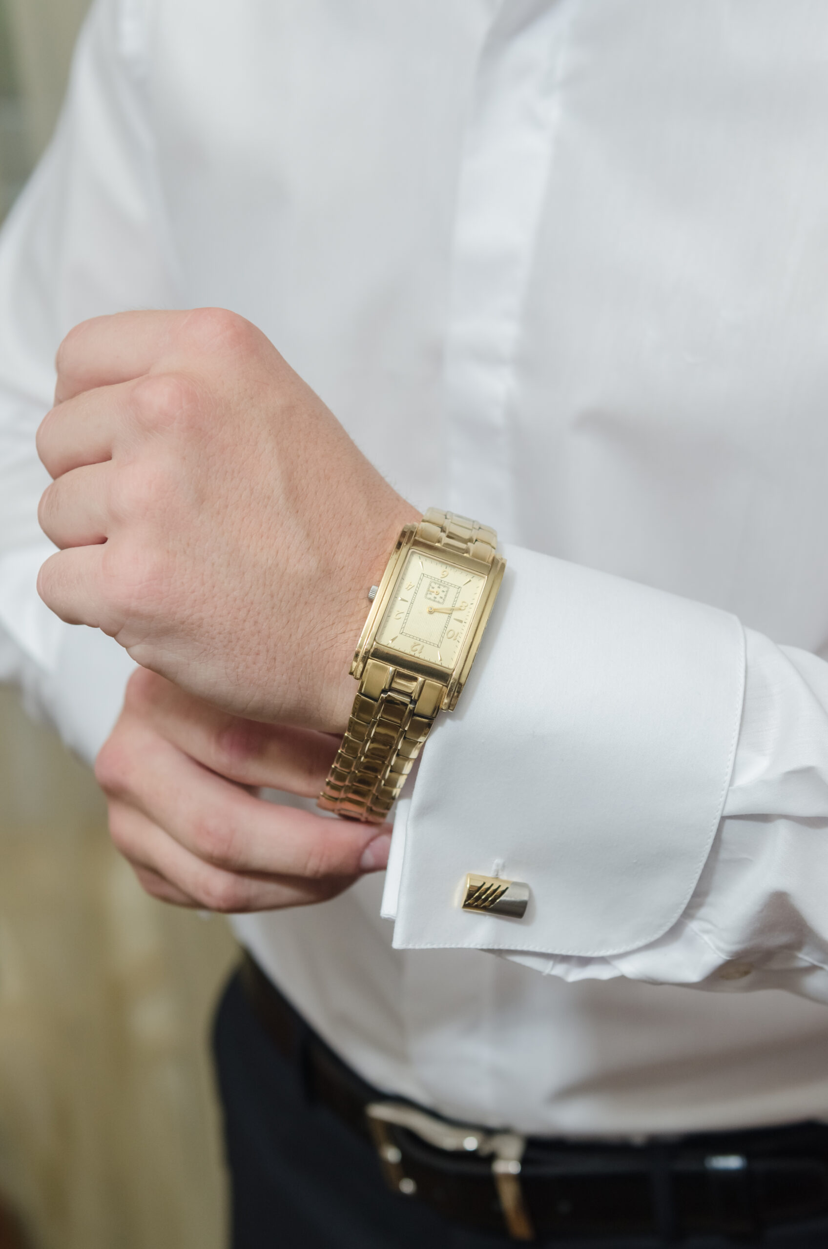 Person wearing gold and silver watch